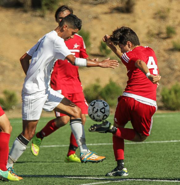 Palomar’s Ivan Curiel (4) keeps control of the ball during the second half. The Comets beat the Knights 3-1 at Minkoff Field on Oct. 13, 2015. (Philip Farry/The Telescope)