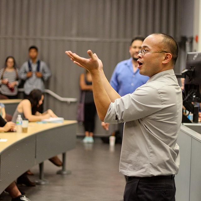 After judges announce the 4-1 result in favor of "team state" at a Political Economy Days student debate, Professor Joseph Limer takes a moment to remind the crowd that they will face serious consequences if caught with marijuana. (Michaela Sanderson/The Telescope)