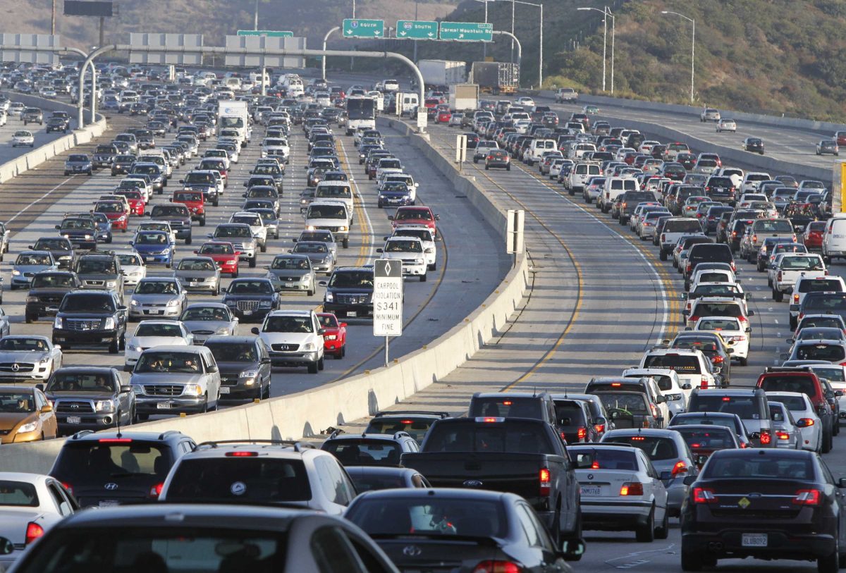 Huge traffic jam on a five-lane freeway in an afternoon.