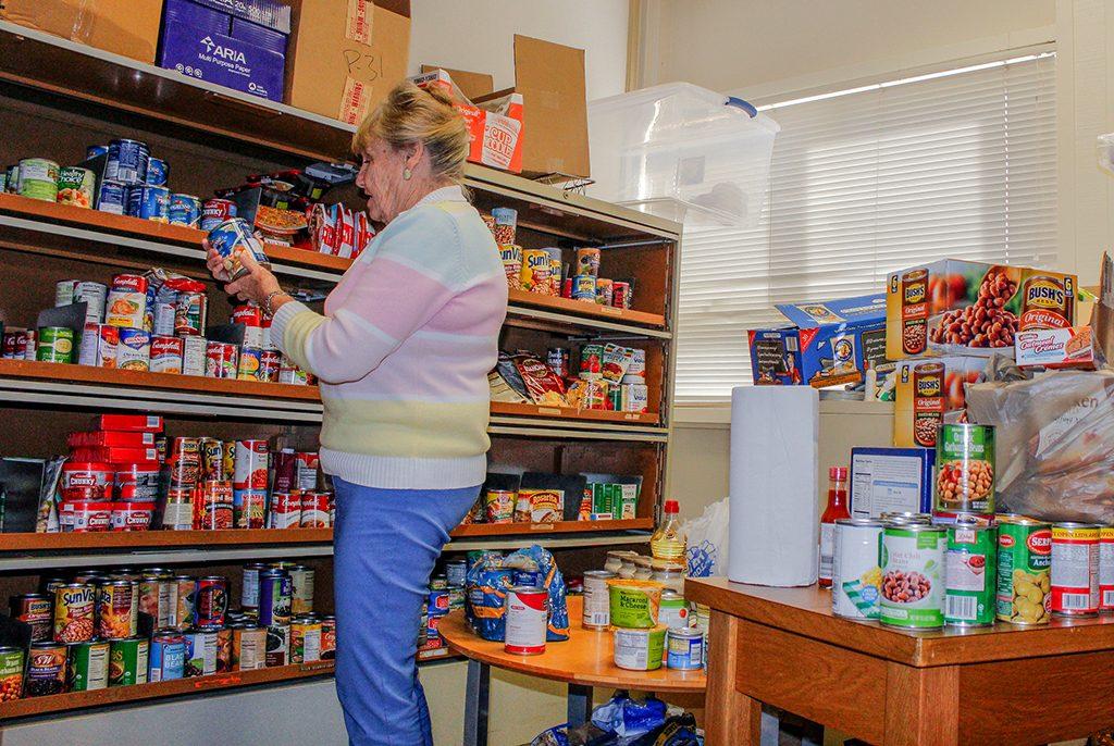 Palomar Colleges Food Bank gets stocked & organized by Staff Assistant Marilyn Lunde. Lunde has been with the Palomar Food bank since its inception in 1986. Nov. 18, 2015. (Hanadi Cackler/The Telescope)