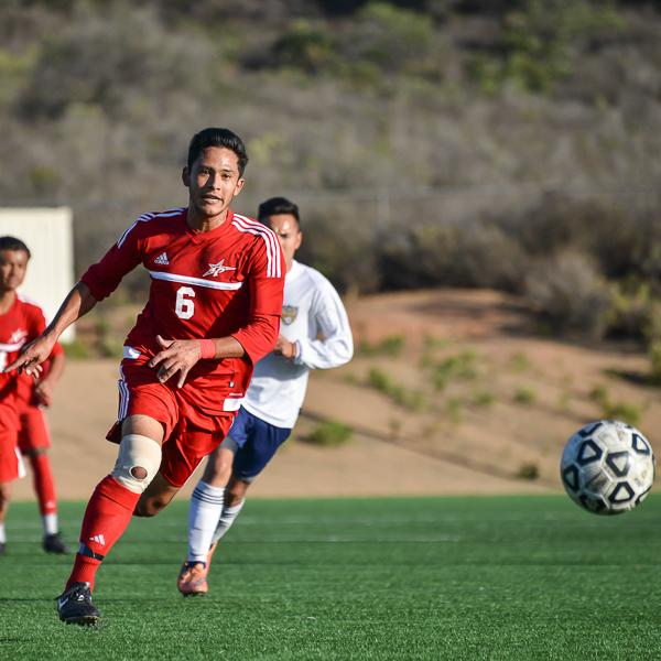 Palomar midfielder Elijah Lopez #6, kicks the ball down field for a goal attempt in the first half of a home game against Mesa College at Minkoff Field Nov. 10, 2015. Final score 1-2 for a Palomar loss in the Pacific Coast Athletic Conference. (Brandy Sebastian/The Telescope)