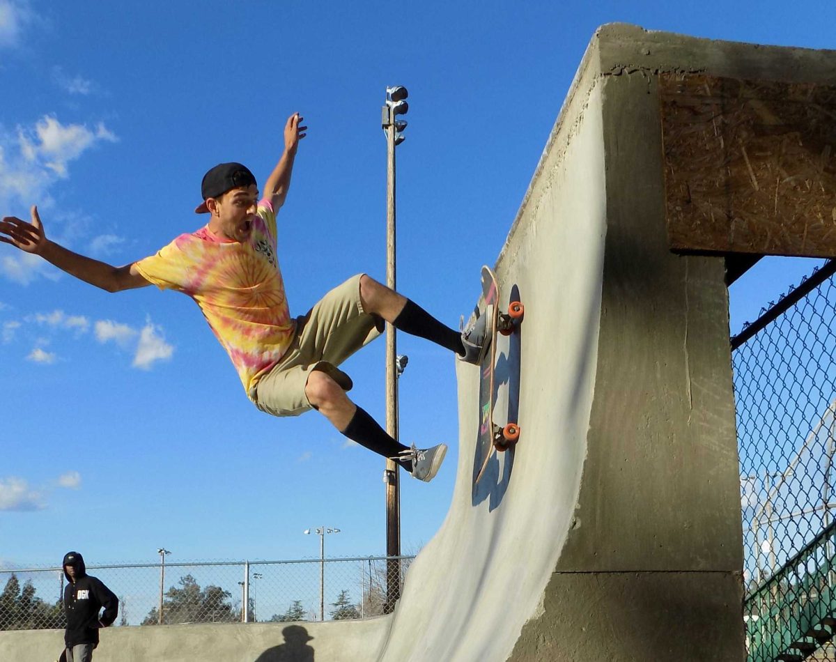 Aaron Adams busting out a “dog pisser” on the quarter pipe at Valley Center Skate Spot on Jan. 31, 2016. (Johnny Mueller/The Telescope)