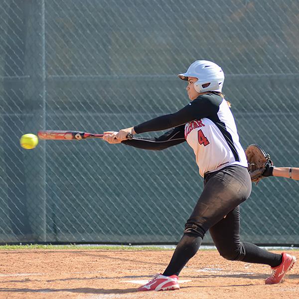 Palomar's Brooke Huddleson (#4) bangs out a double on her home-field during the March 30, 2016 game against the San Diego City College Knights. Palomar won 9-0. (Tracy Grassel/The Telescope)