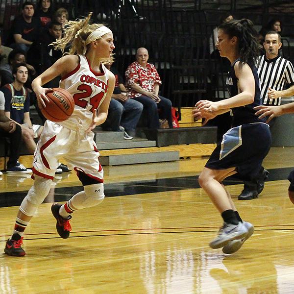 Palomar's Cheyenne Ertz (24) gets ready to pass the ball during the women's basketball game against Mira Costa at the Dome on Jan. 27. Mira Costa players Jessica Ramirez (left) and Alynne Nguyen (right) attempt to defend. The Comets won 83-34. (Coleen Burnham/The Telescope)