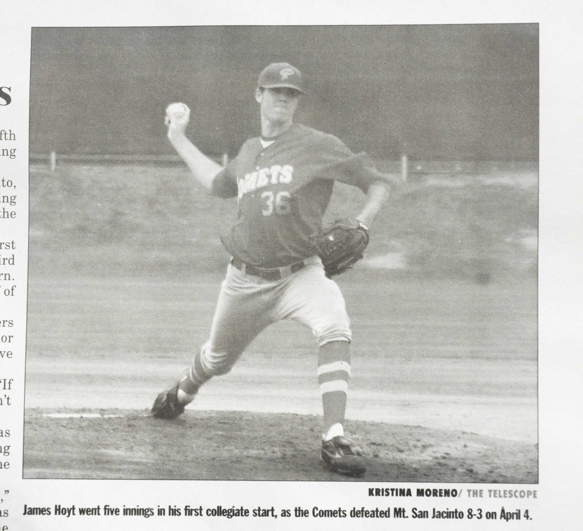 A print photo of a male Palomar baseball player cocking his right hand back to throw a baseball. (black and white photo)