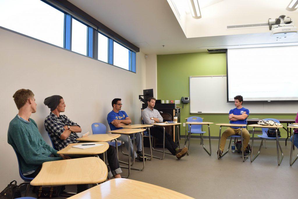 Students listen as Dr. Adam Meehan analyzes and discusses The Great Gatsby during the book seminar that was held in HS-207 on Sept. 8 at 6 p.m. (Telescope Staff/The Telescope)