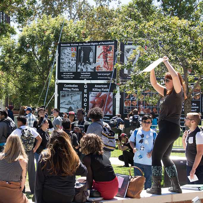 Palomar student Hali Scott (23) takes matters into her own hands and starts protesting against the fetus banners posted on campus on Sept. 14, 2016. (Melissa Rodas/The Telescope)