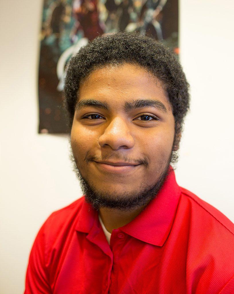 Student body President Malik Spence poses for a portrait in his office on Sept 14, 2016. When Malik has down time he is a huge fan of watching comic book movies. (Cam Buker/The Telescope)