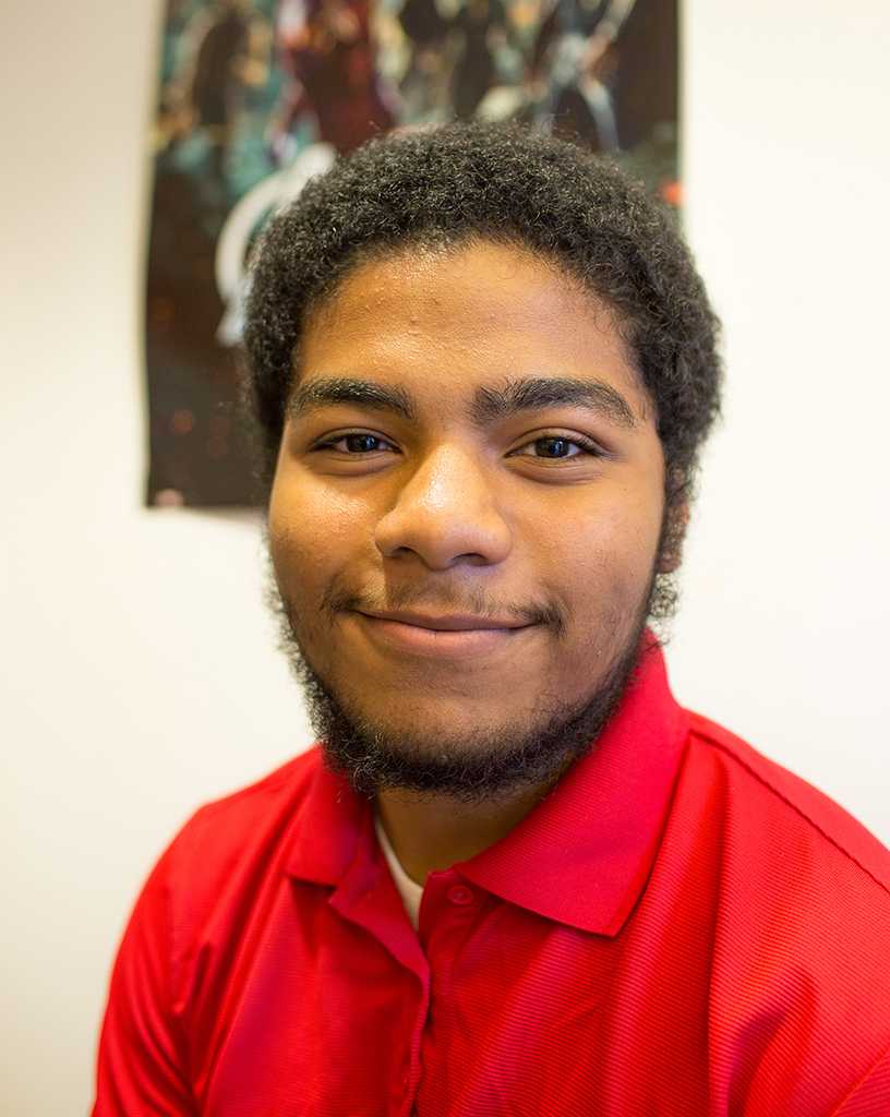 Student body President Malik Spence poses for a portrait in his office on Sept 14, 2016. When Malik has down time he is a huge fan of watching comic book movies. (Cam Buker/The Telescope)