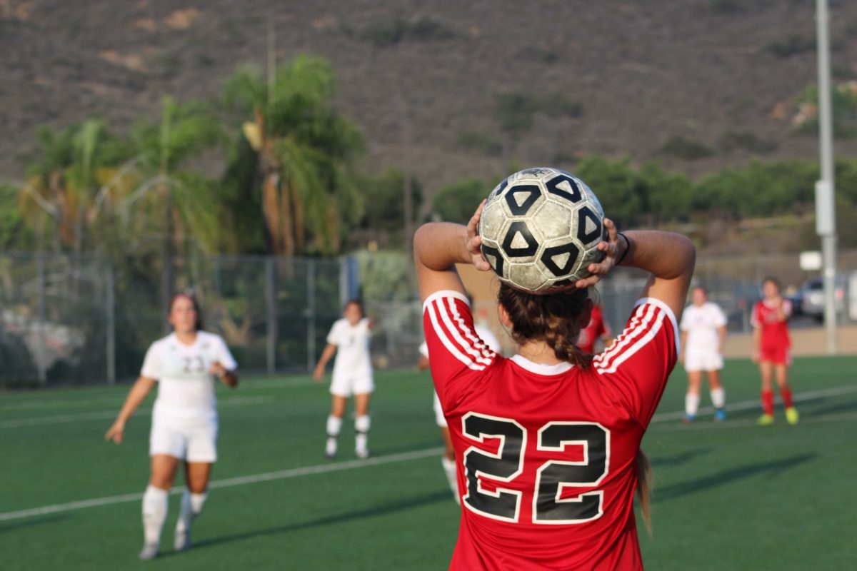 Grace Busby throws the ball for the sideline pass against Southwestern on Oct. 23, 2015 at Minkoff Field; Comets win 3-1. (Jennifer Gutierrez/The Telescope)