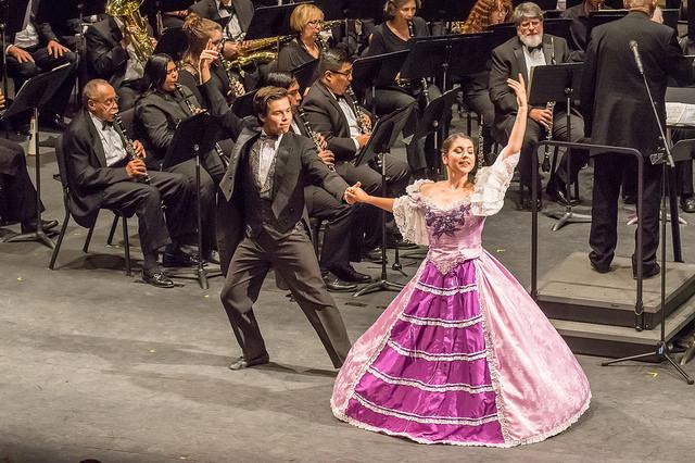 The Palomar Contemporary Dance Ensemble dances while Kenneth Bell conducts the Palomar/Pacific Coast Concert Band during the performance at the Winds of Change concert at the Palomar College Howard Brubeck Theatre on Oct. 21, 2016. (Joe Dusel/The Telescope)