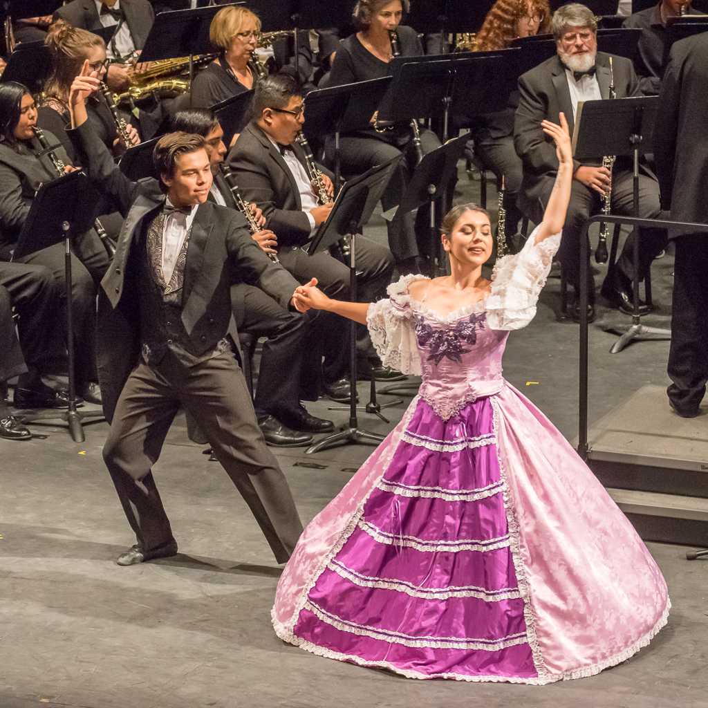 The Palomar Contemporary Dance Ensemble dances while Kenneth Bell conducts the Palomar/Pacific Coast Concert Band during the performance at the Winds of Change concert at the Palomar College Howard Brubeck Theatre on Oct. 21, 2016. (Joe Dusel/The Telescope)