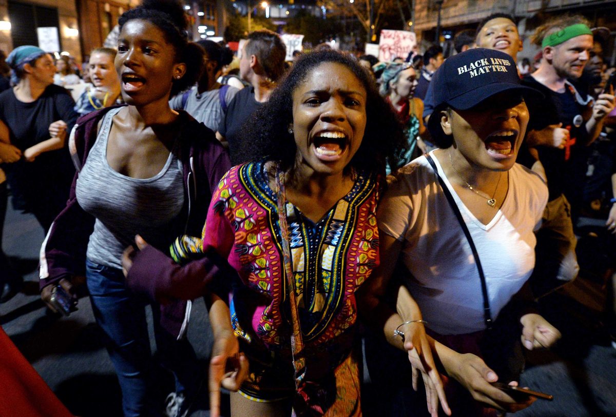 Protesters chant “Black Lives Matter” as they march throughout the city of Charlotte, N.C., on Friday, Sept. 23, 2016. Demonstrations continue following the shooting death of Keith Scott by police earlier in the week. (Jeff Siner/Charlotte Observer/TNS)