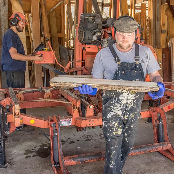 The Palomar College Cabinet and Furniture Technology Department student Brett Ritchey saws a log on the sawmill with Liam Liedorff assisting. October 20, 2016. Joe Dusel/ The Telescope.