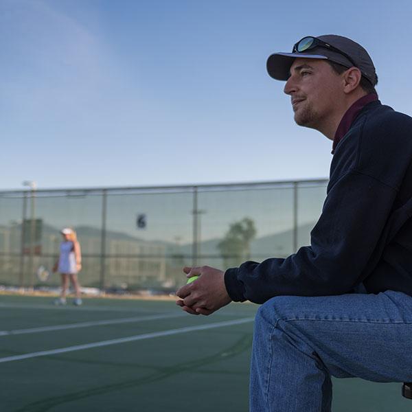 Coach Tissot watches the players on the court. (Raul Aguilar/The Telescope)