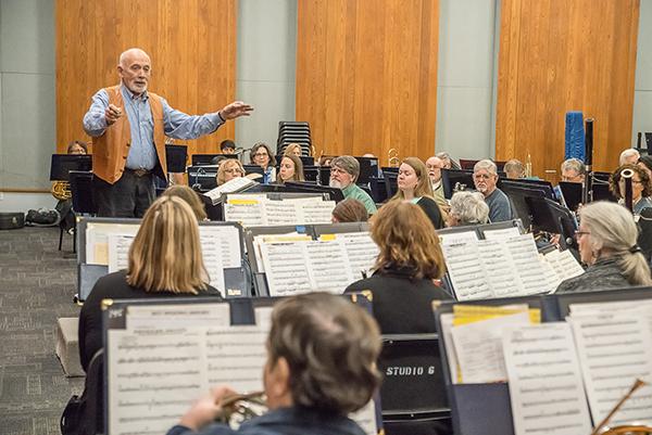 Kenneth Bell conducts the Palomar/Pacific Coast Concert Band during a rehearsal on Feb. 16, 2017 for their upcoming performance at Palomar College. (Joe Dusel/The Telescope)