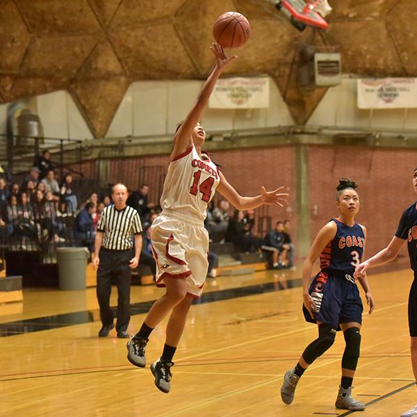 PCAC Player of the Year Roshell Lamug (14) scored a total of 7 points in the 80-77 win against the Orange Coast Pirates in the second round of the CCCAA Tournament. (Melissa Grant/The Telescope)