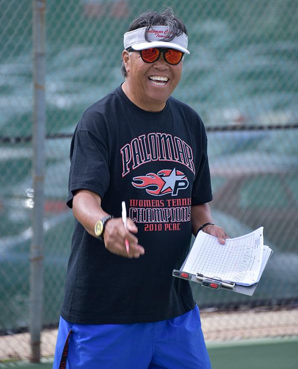 Kinesiology 100 instructor Ronnie Mancao and other staff member demonstrate various physical activity excises for the group to follow at Palomar tennis courts Feb. 22, 2017. (Johnny Jones/The Telescope)