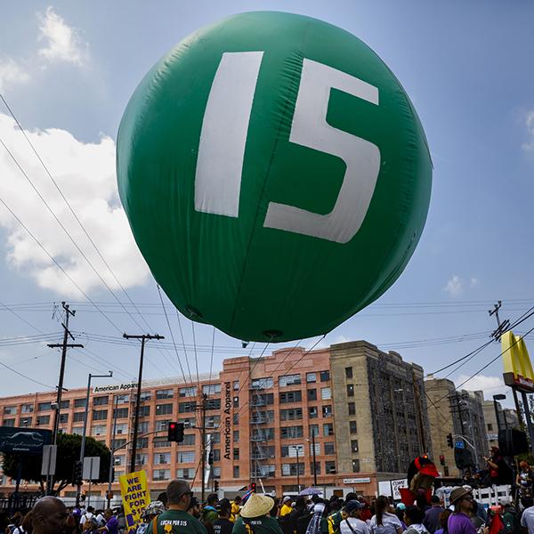 Workers march through downtown Los Angeles on April 14, 2017 to demand a nationwide $15-an-hour minimum wage. (Jay L. Clendenin/Los Angeles Times/TNS)