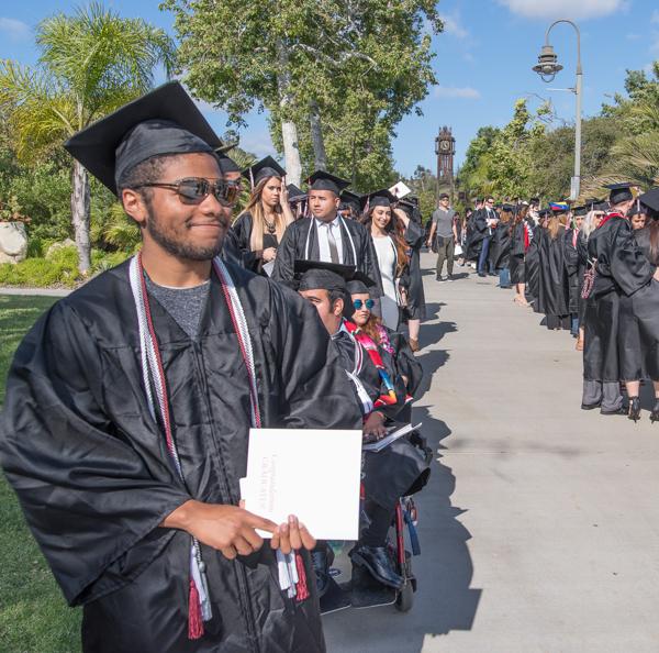 ASG President Malik Spence (left) at the front of the line of graduating students as they wait in line before the commencement ceremony at Palomar College in San Marcos, San Marcos, Calif. on May 26, 2017. (Joe Dusel/The Telescope)