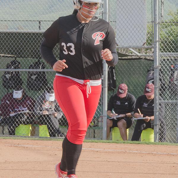 Palomar College Comets right field utility player, Tiare Paopao, returns to the dugout during the Comets game against the Southwestern College Jaguars on April 7, 2017 at Palomar College. The Comets beat the Jaguars 10-1 in six innings to remain undefeated in the Pacific Coast Athletic Conference. (Kathleen Coogan/The Telescope)