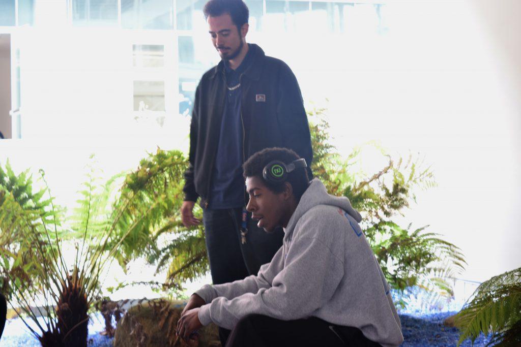 Bryan Hernandez, or “Dr. Peppa” (back) listens as Judah El, or “Good Savage” (right) freestyle over a beat. MD building. May 10, 2017. (Jacob Tucker/The Telescope)