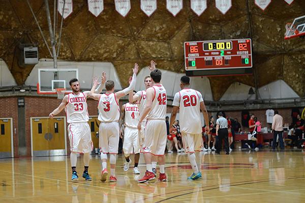 The Palomar College Comets celebrate with high-fives after defeating San Diego City College 86-82 on Feb. 5, 2017 in the Dome. (Tracy Grassel/The Telescope)