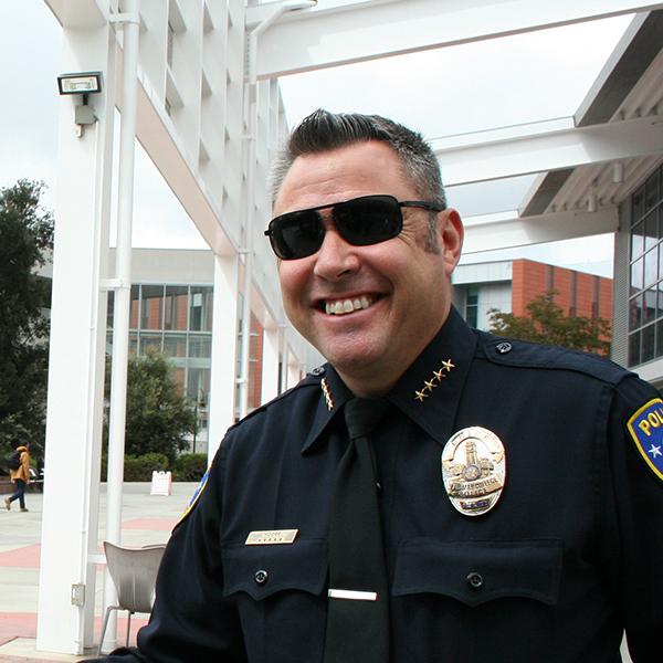 Palomar College Police Department Chief Chris Moore with student Mike Neill during Coffee With A Cop on Sept. 21, 2017. Neill stopped by the tables outside the cafeteria to "grab a free cup of coffee and thank the officers for all they do." (Marissa Boyd/The Telescope)