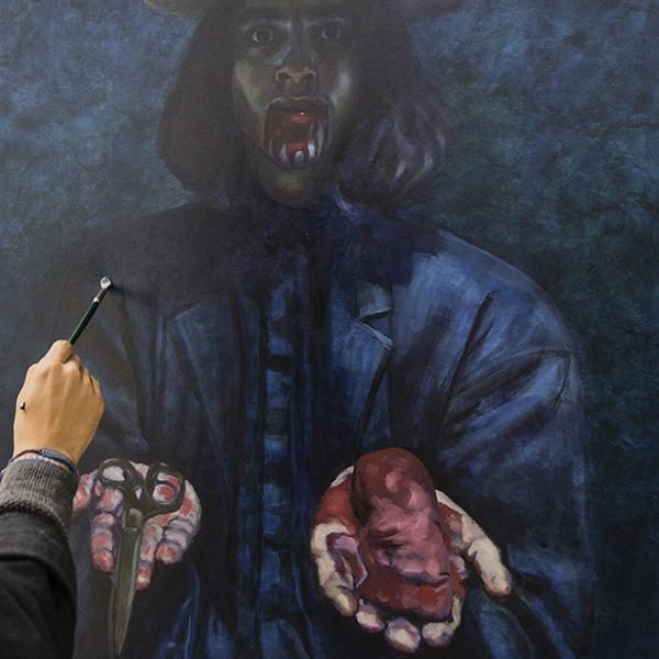 Palomar art student Matthew Perez paints a self portrait. (Larie Tobias Chairul/The Telescope)