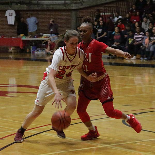 Comets player, Andrea Laurent, protects the ball from an opponent, Feb 2, 2018. Laurent scored 12 points overall for the team. (Taylor Hardey/The Telescope)