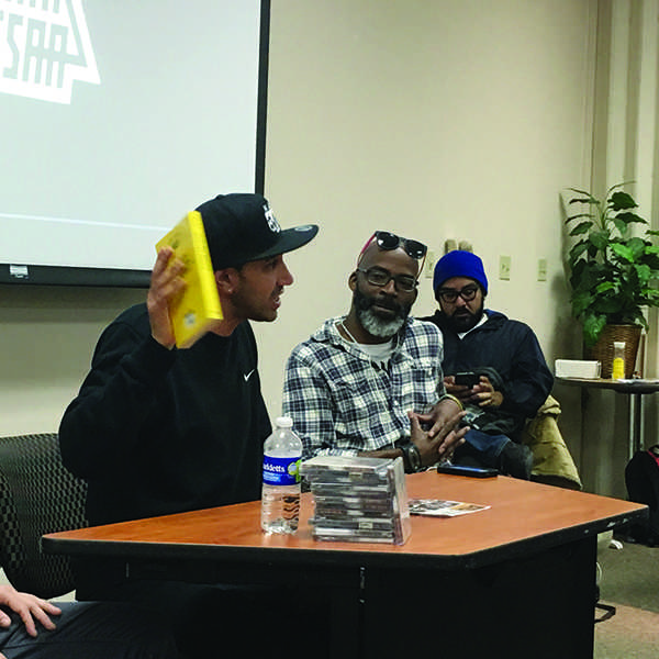 Amir Issa speaking to students about his music at San Diego State University on March 6. (Pat Hartley/The Telescope)