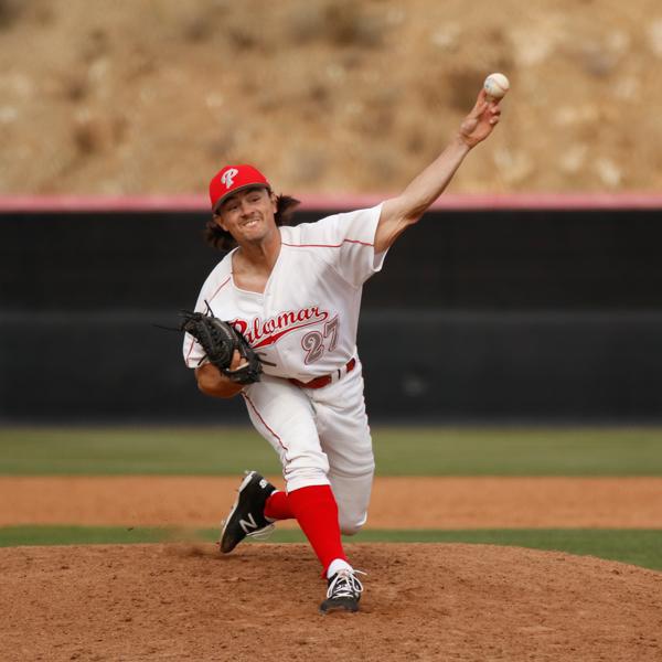 A male Palomar baseball pitcher throws a baseball with his left hand, his right leg steps in front of him.