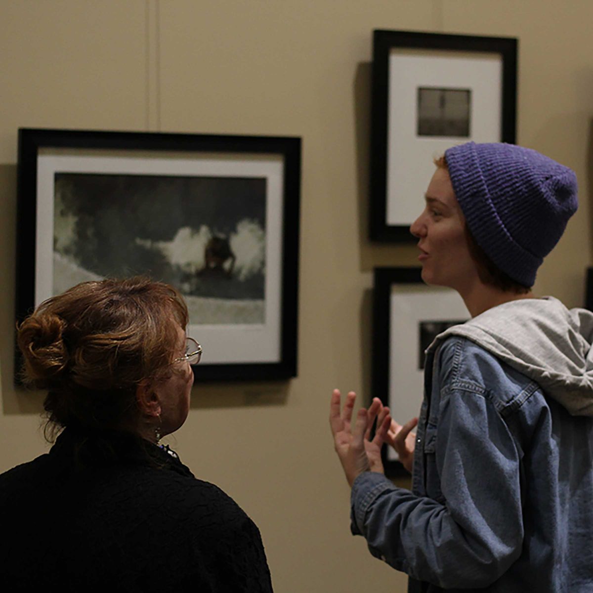 Photography professor Judith Preston and student Alexandra Dexter at the Enlightened Lens reception. Feb 9, 2018. (Aubree Wiedmaier/The Telescope)