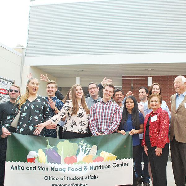 Members of the Palomar community pose for a group shot alongside Anita Maag (third from right) and Bob Wilson (second from right). (Linus Smith/The Telescope)