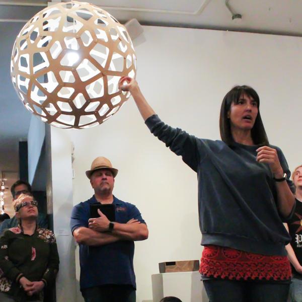 Jennifer Anderson speaks the round lamp at the Boehm Gallery on April 5, 2018. (Belen De Anda/The Telescope)