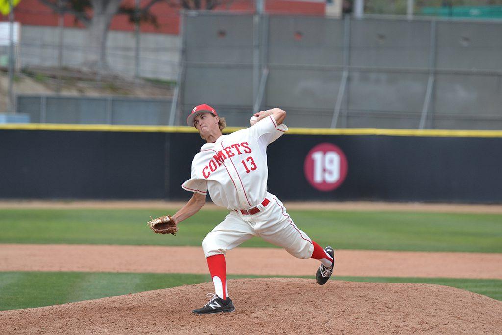 A male Palomar baseball pitcher cocks his left hand behind his left shoulder to throw a baseball.