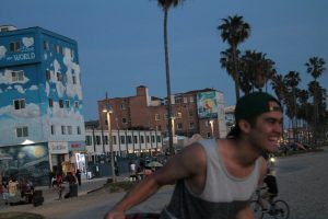 Jonathan Muro laughs while learning to hula hoop dance on April 10 in Venice, Calif. Bethany Nash/Impact Magazine