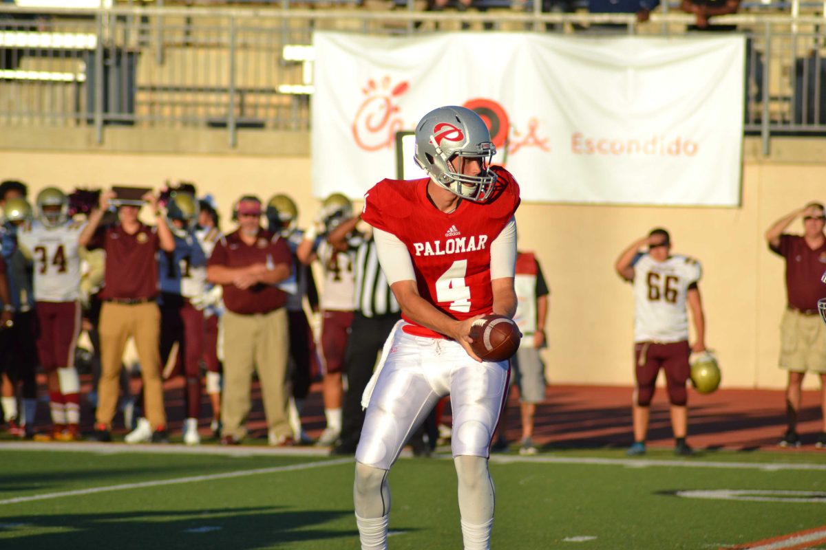 Quarterback Adam Carr handing the ball off in Palomar's 42-6 loss against Southwestern. Sept. 8,2018. (Krista Moore/The Telescope)