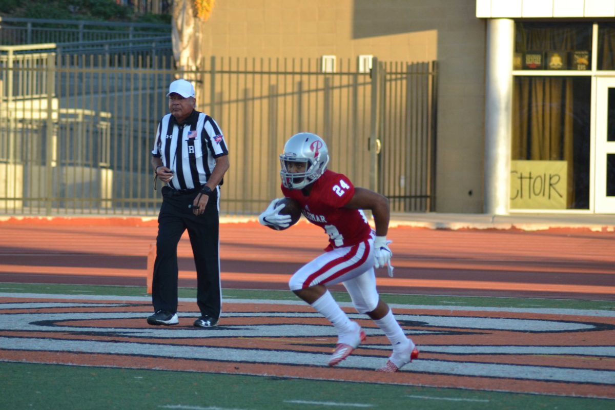 Running back Damon Wigand reciving the ball at kickoff.