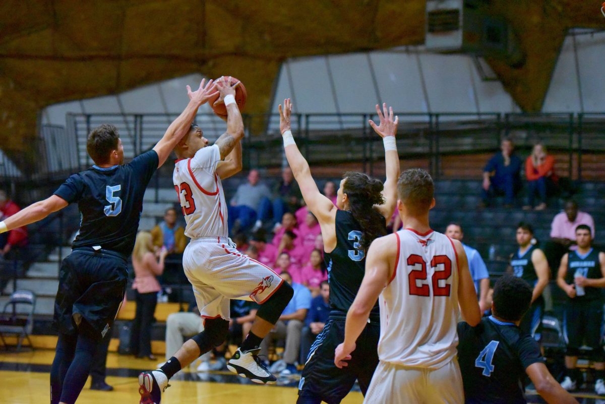 Palomar Guard Brevin Robinson (23) drives to the basket scoring 2 of his 23 as the Comet’s defeat Miramar College Jets in 99-98 in the dome Feb 10. Johnny Jones/The Telescope