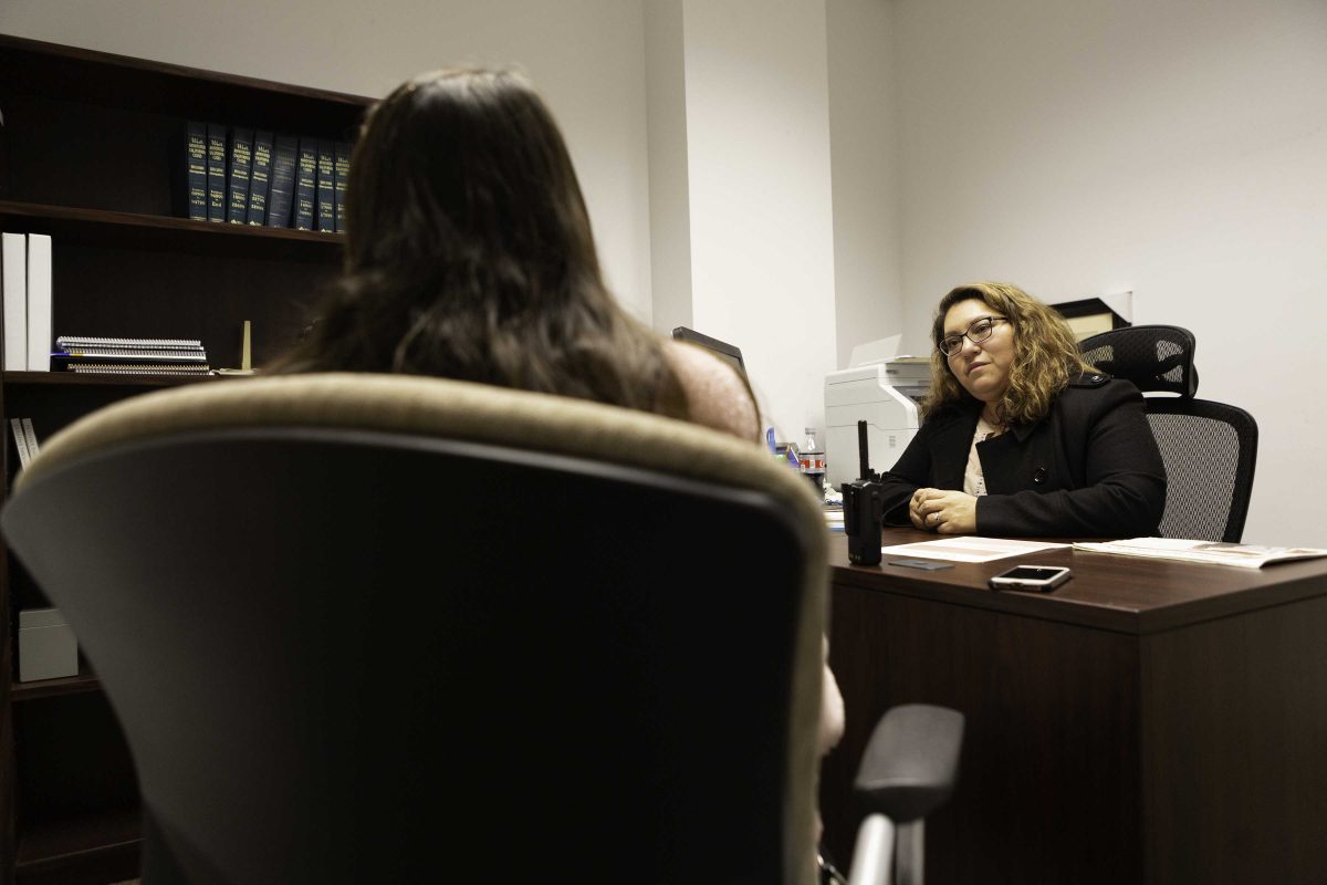 Anel Gonzalez (CCE President) attentively listening to the grievances of Cynthia Davalos (back to the camera), a custodian. Sonny Cavarlez/The Telescope