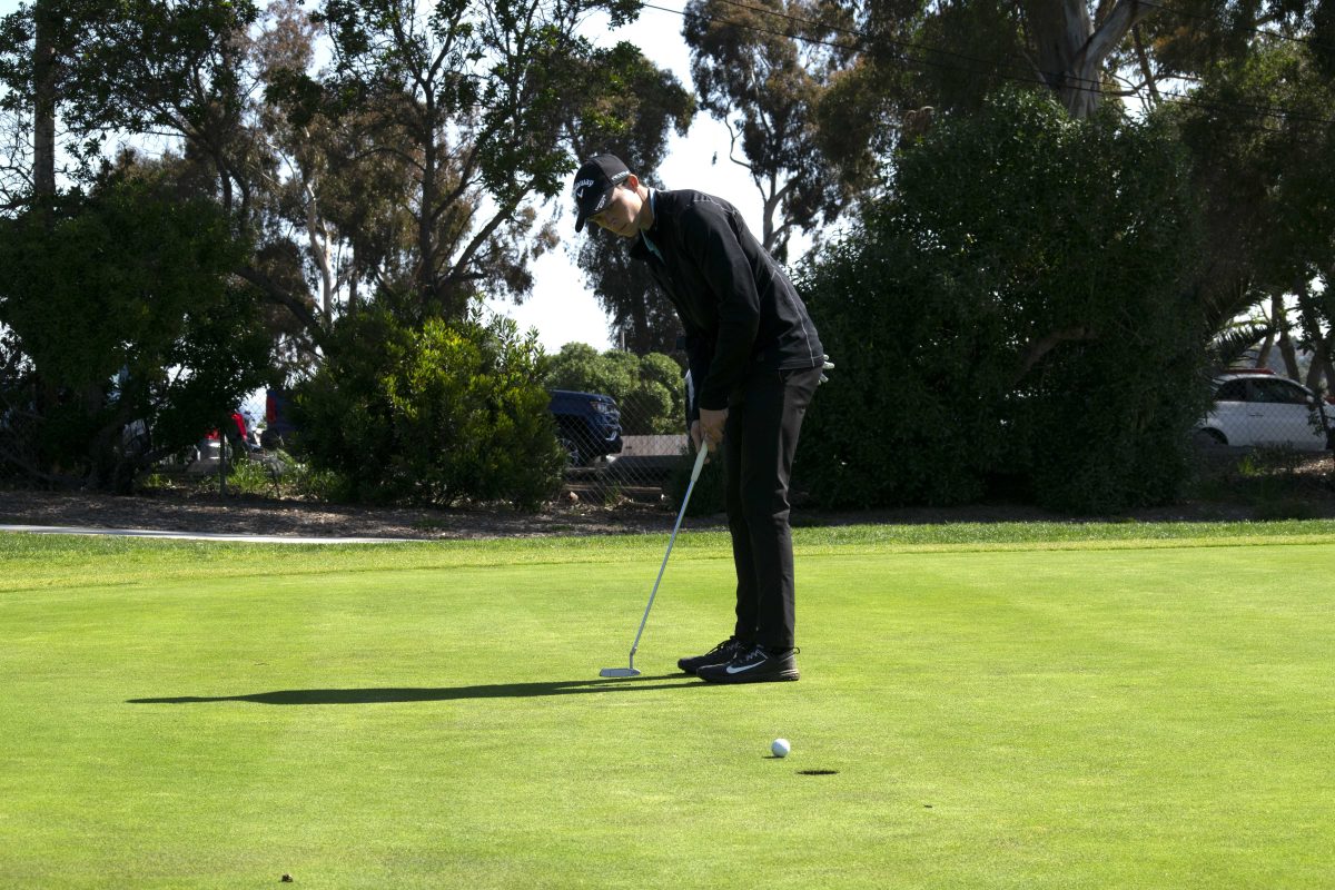 Palomar Comet Zachary Brown, putting down the green at Goat Hill Park on Feb. 27, 2019. (Emily Whetstone/The Telescope)