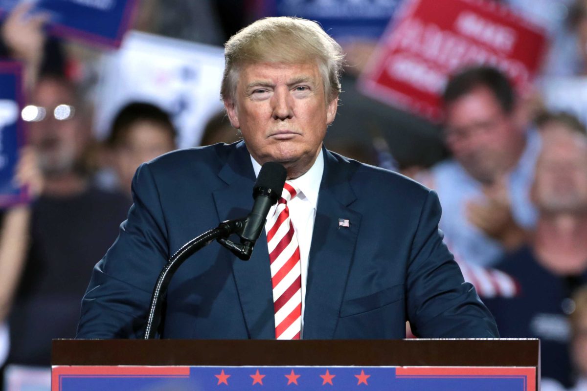 Donald Trump looks out from a podium at a campaign rally in Prescott Valley, Ariz. "Donald Trump (29496131773).jpg" by Gage Skidmore is licensed under CC BY-SA 2.0.