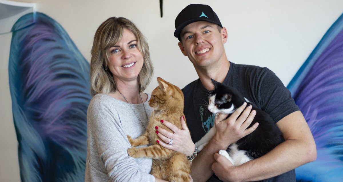 owners of Cat and Craft holding cats