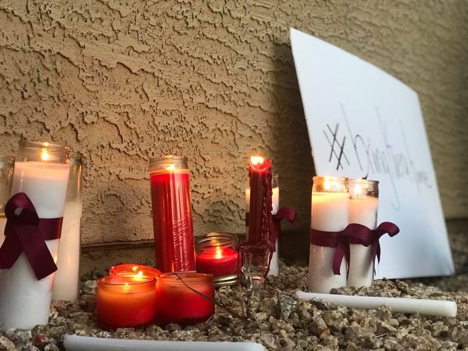 lit candles next to bring kiera home sign