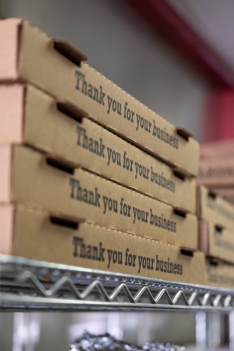 stacked pizza boxes labeled thank you for business