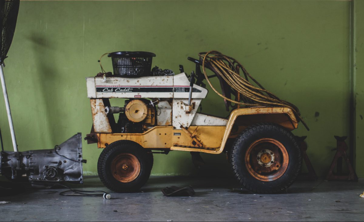 lawn tractor surrounded my parts ad tools