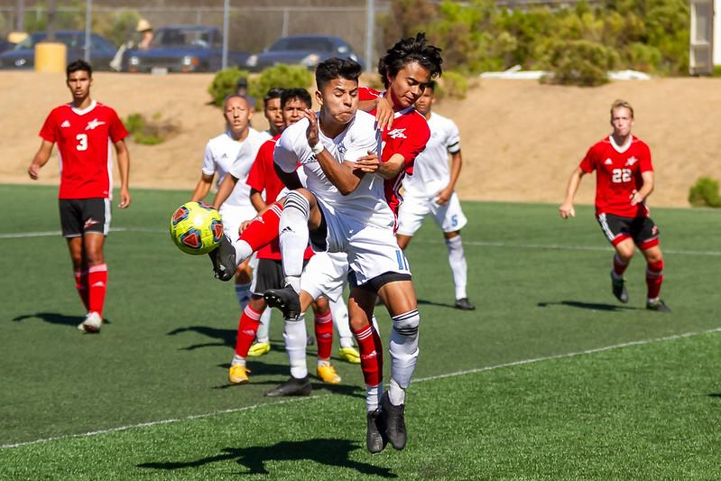 Comet midfielder Andy Zazueta gets tangled up as he leaps for control of the ball inside the Cuyamaca penalty box during the match on Oct. 4, 2019. The Palomar College Men's Soccer Team outplayed visiting Cuyamaca College, but had to settle for with a 1-1 tie. (Benjamin King/The Telescope)