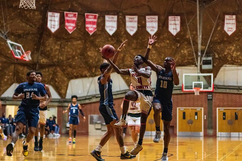 Palomar men’s Basketball guard Anthony Brewer fights off the defenders during Palomar’s 56-61 loss against MiraCosta College on January 31st. Kevin Mijares/The Telescope