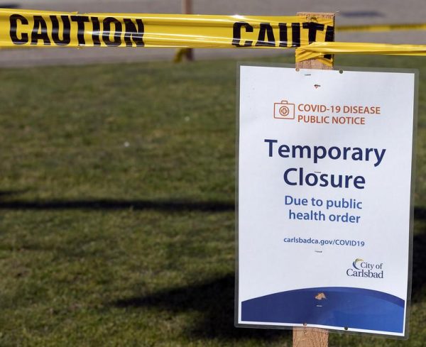 Virus Affected Communities. Carlsbad, Calif. Park Closure sign along Carlsbad Boulevard & Pine Avenue. (Adel M Bautista/The Telescope)